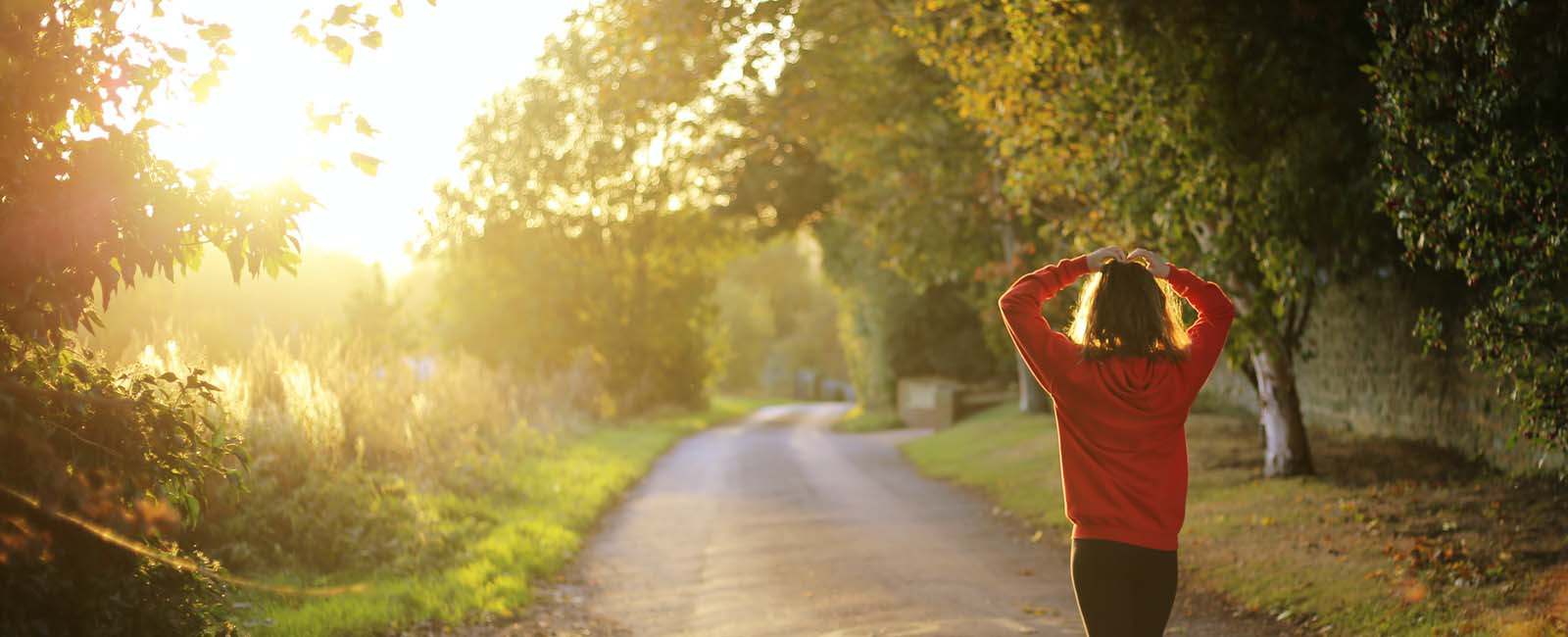 A young woman finishes her morning run